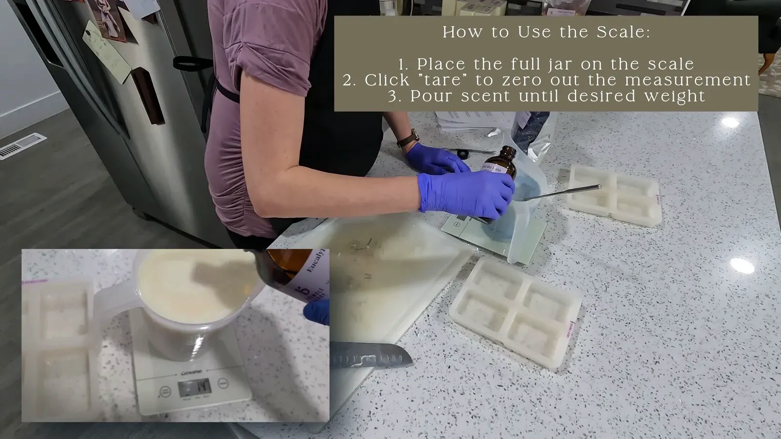 A hand pouring a measured amount of fragrance oil from a small bottle into a pitcher of melted soap base on a digital scale.