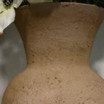 A close-up of the finished stone-look ceramic vase, showcasing its detailed texture and aged finish.