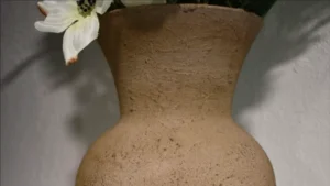 A close-up of the finished stone-look ceramic vase, showcasing its detailed texture and aged finish.